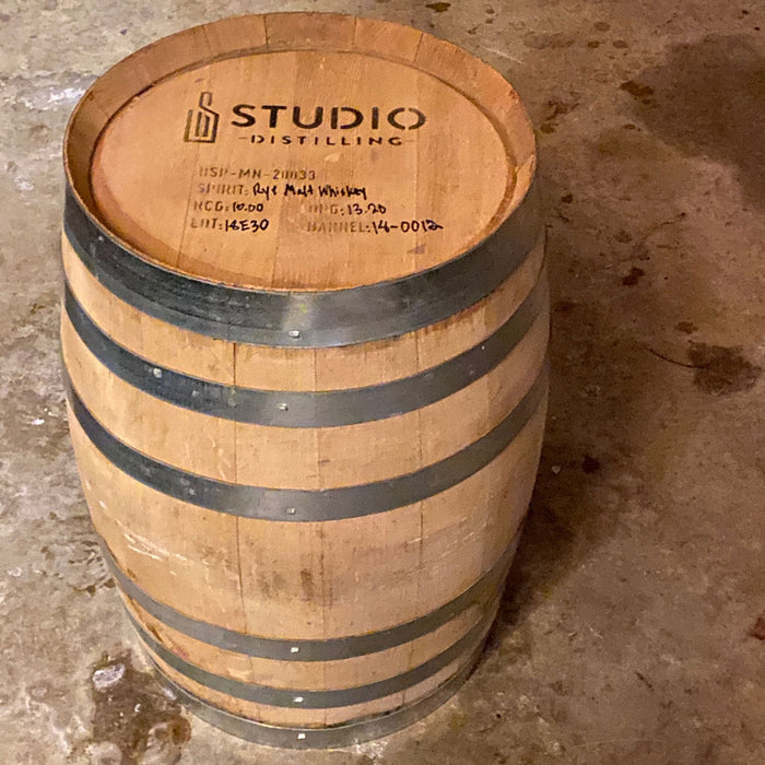 Studio Distilling Barrel on the end showing head with distillery info