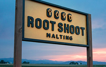 Root Shoot Malting Sign in Front of Sunset