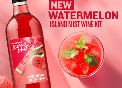 New Watermelon Island Mist wine kit with a bottle and a glass of wine on a pink background
