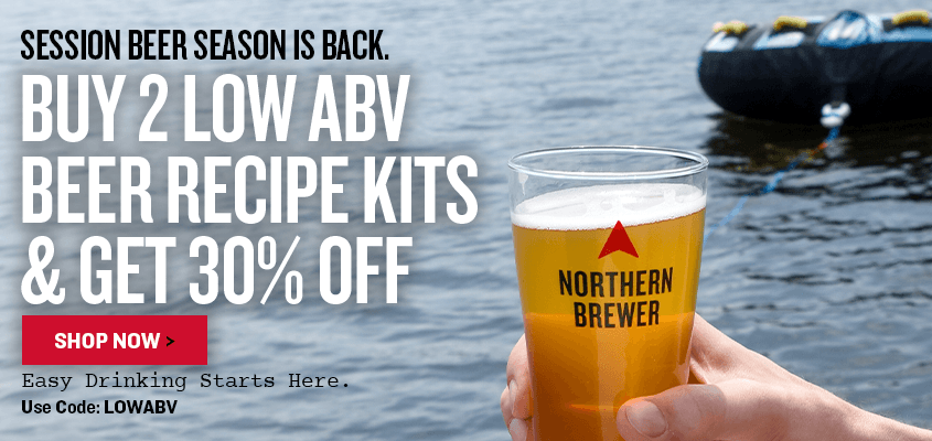Promotional advertisement for Session Beer Season Is Back. Buy 2 or more Low ABV Kits and save 30% with code LOWABV Easy Drinking Starts Here. with a hand holding a glass of beer by a body of water.