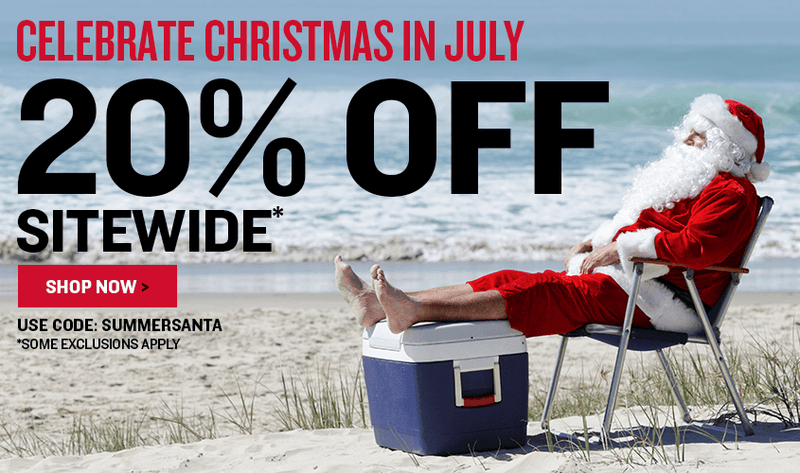 A beach scene with a reclining Santa Claus sitting in a folding chair beside a cooler, with large overlaid text reading 'CELEBRATE CHRISTMAS IN JULY', '20% OFF SITEWIDE* Use Code: SUMMERSANTA *Some Exclusions Apply', and a 'SHOP NOW' button.