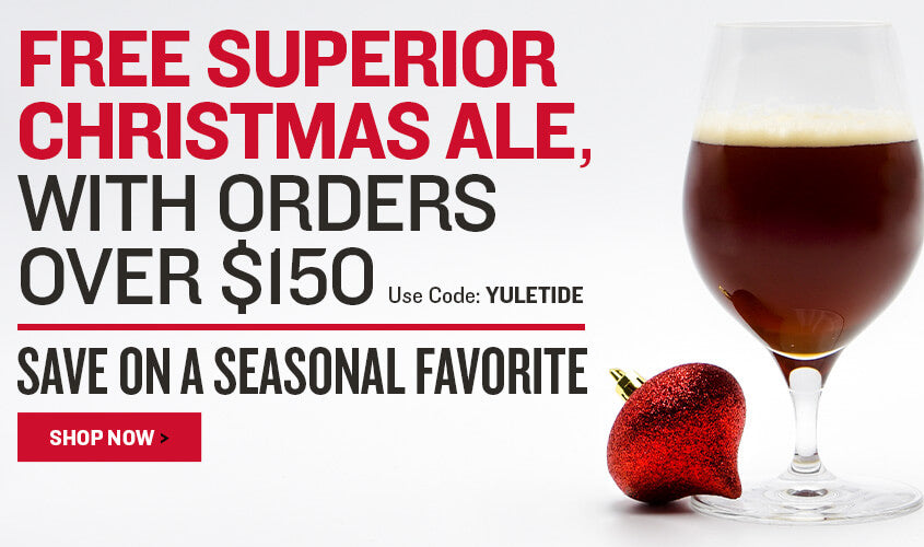 Advertisement for free superior Christmas ale with orders over $150, featuring a glass of dark beer and a red berry on a white background. Use code: YULETIDE