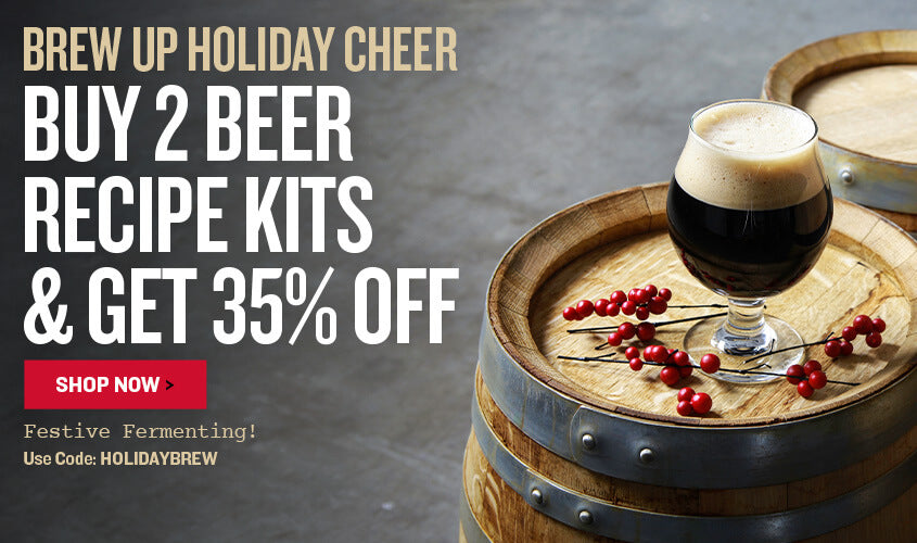 Promotional banner for beer recipe kits with a glass of dark beer on a wooden barrel.