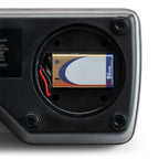 Close-up of the open battery compartment on the Milwaukee MA884 refractometer with a 9V battery installed