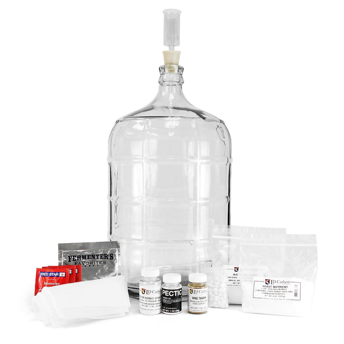 Master Vintner Fresh Harvest 5-Gallon Upgrade, containing a winemakers handbook, 5-gallon glass carboy, straining bag, and various chemicals for cleaning and stabilizing