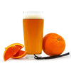 Glass of Cream Ale  with an orange, vanilla bean, and orange slices on a white background
