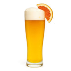 Sunny Side Grapefruit Radler in a glass with a grapefruit wedge