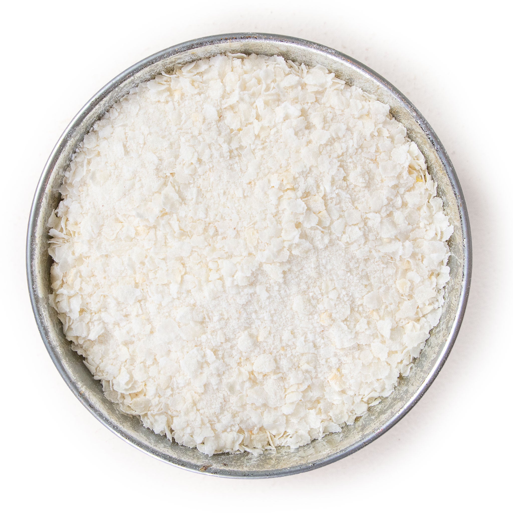 Pile of flaked torrefied rice in a small bowl.