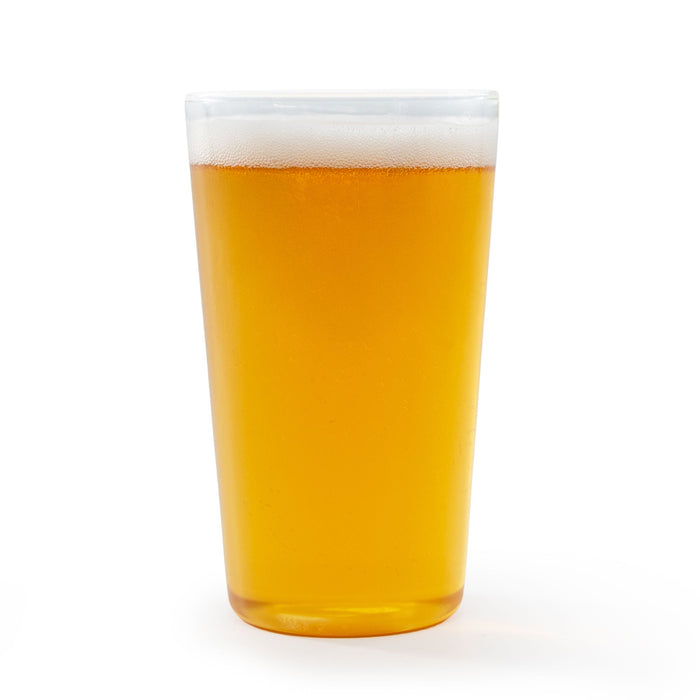 Glass of NA American Blonde Ale with a white background