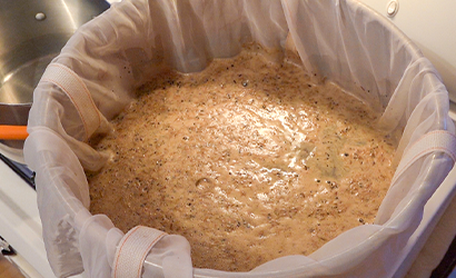 Brew kettle with a large container of wort.