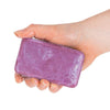 A hand holding a bar of Wine Soap - Vintage Merlot