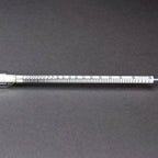 Close-up of the scale on the Proof/Tralle Alcoholmeter for distilled spirits