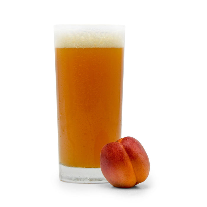 Apricot next to Fruit Stand Wheat Beer in a glass