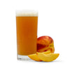 Sliced and whole Peaches next to a glsas of Fruit Stand Wheat Beer