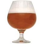 Shugga High Barleywine in a half-filled glass